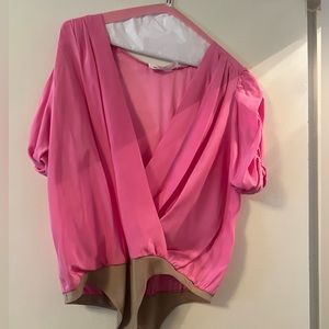 Amanda Uprichard pink silk bodysuit.